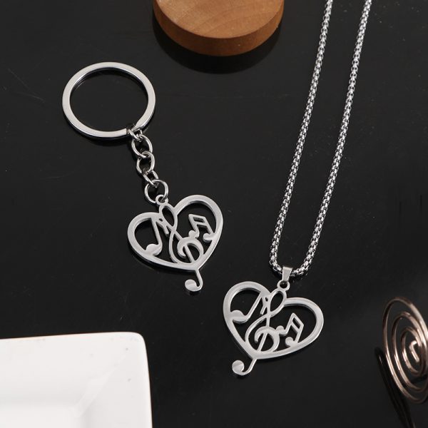 Titanium steel musical note necklace, men's heart-shaped hollow pendant, keychain, women's design sense, high aesthetic value, versatile pendant with accessories